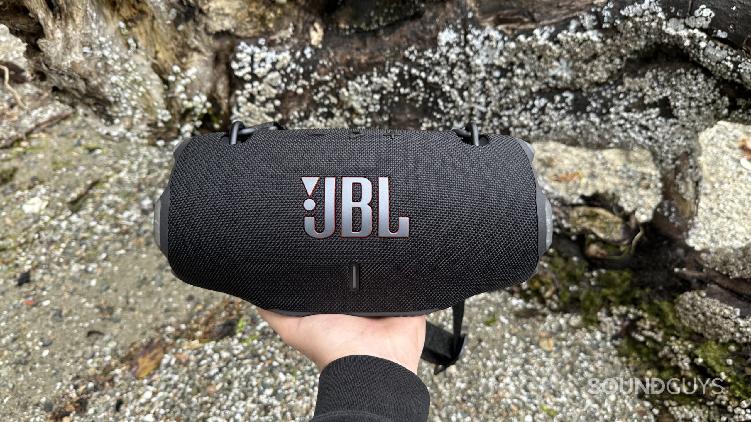 JBL Xtreme 4 hand A hand holding the JBL Xtreme 4 speaker, directly facing the camera.
