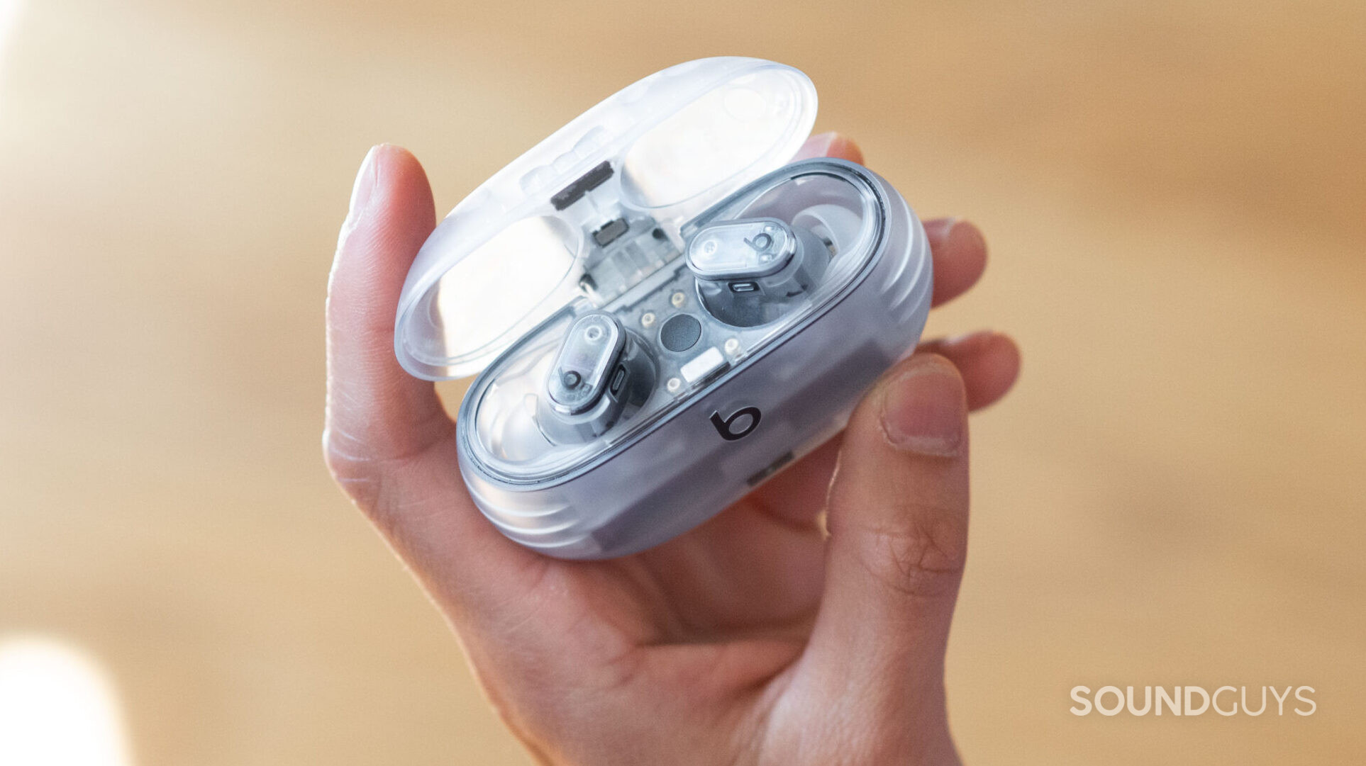 Beats Studio Buds Plus hand holds case A hand holds the The Beats Studio Buds Plus case.