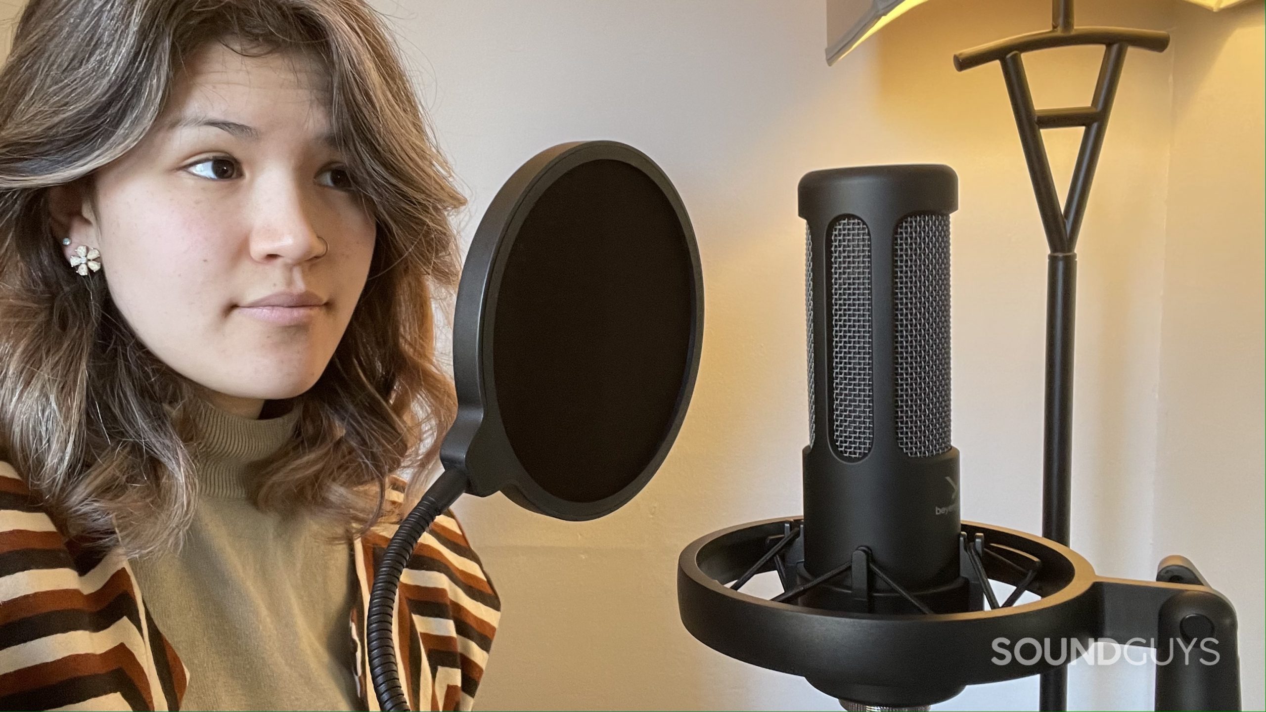 Beyerdynamic M90 PRO X 5 Woman using the Beyerdynamic M90 PRO X with its pop filter.