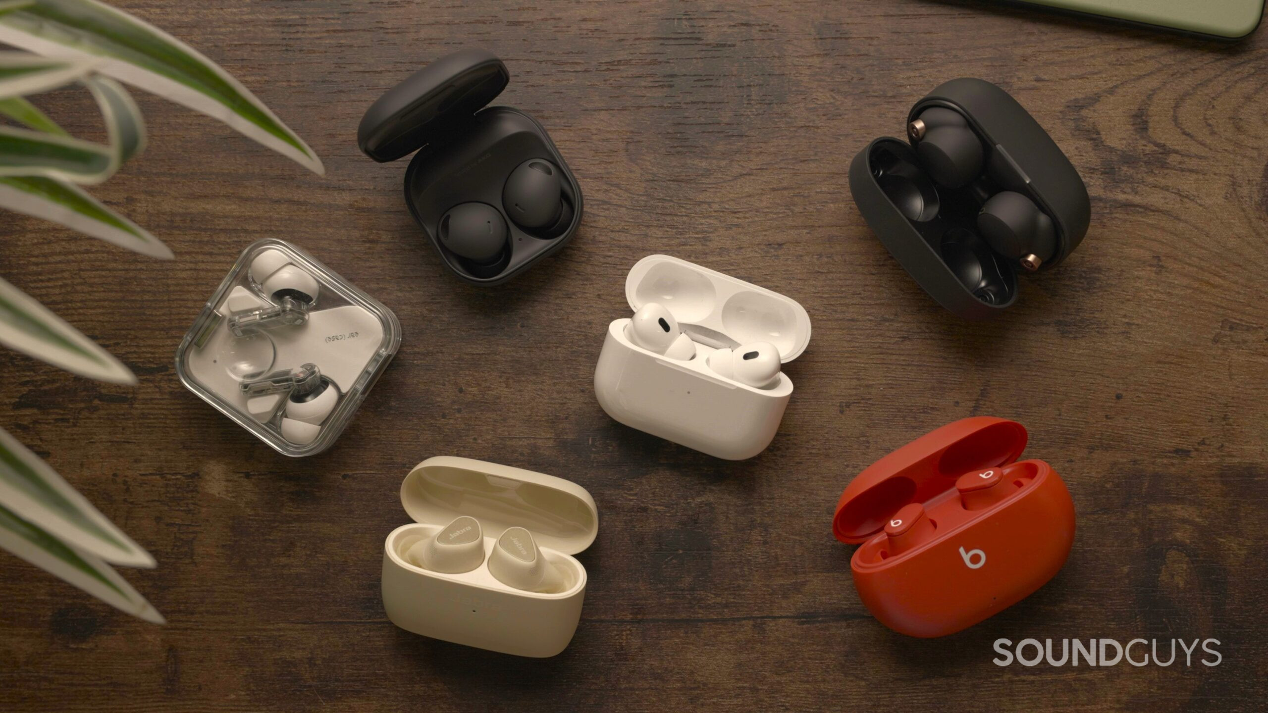 best wireless earbuds group image 2 The best wireless earbuds on a wooden surface.