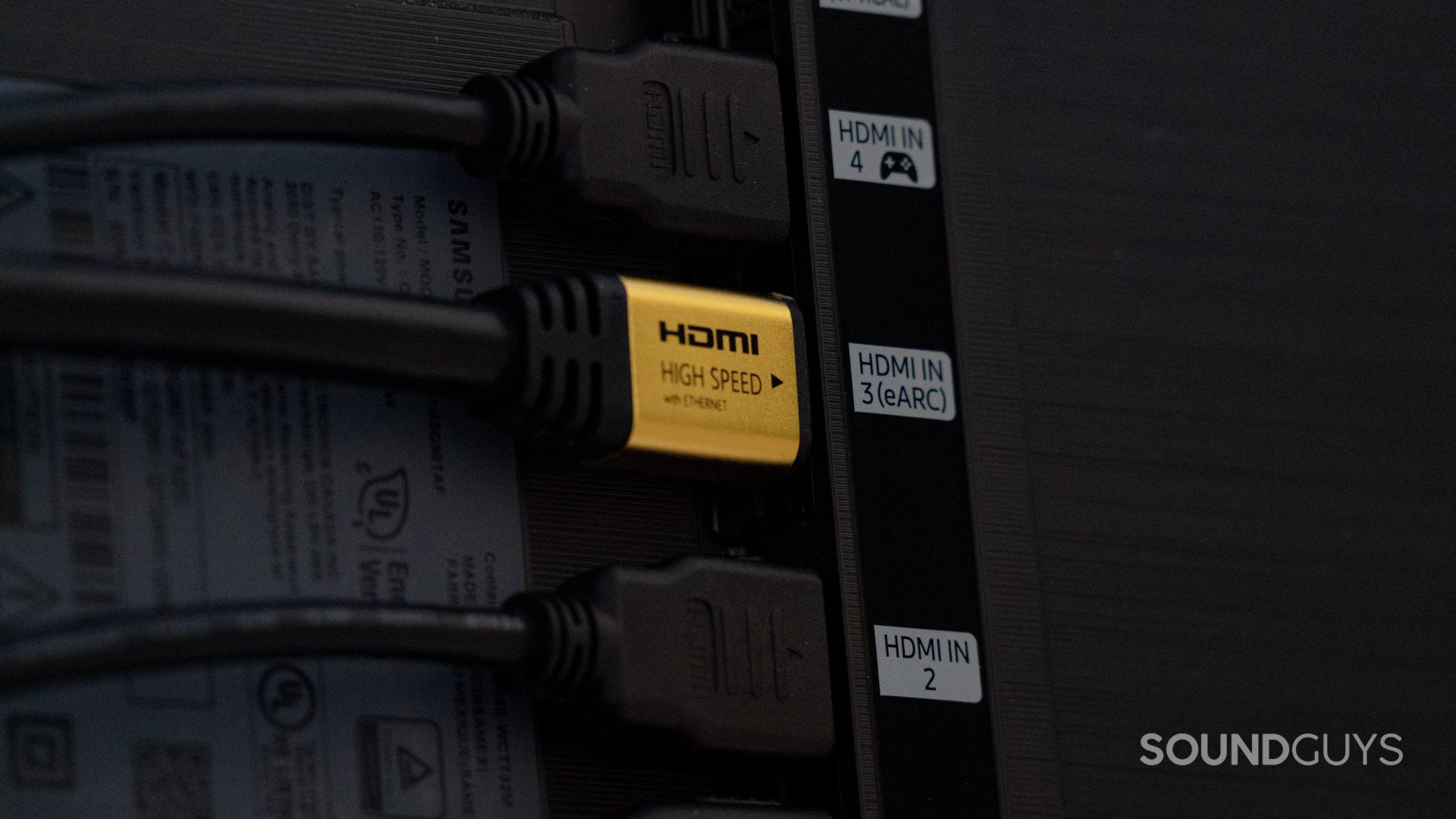 HDMI_1 A row of HDMI input sockets on the back of a TV, one of which is labelled HDMI eARC. A cable is plugged into each one.