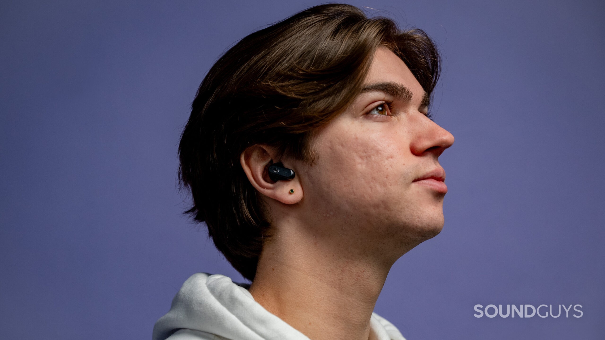 skullcandy-dime-3-on-model Skullcandy Dime 3 earbuds on a model.