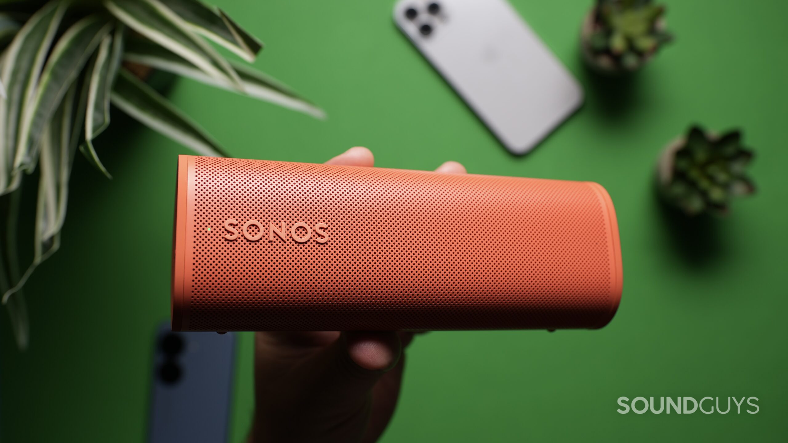 Sonos Roam 2 Close up Top down photo of the Sonos Roam 2 held in a hand.